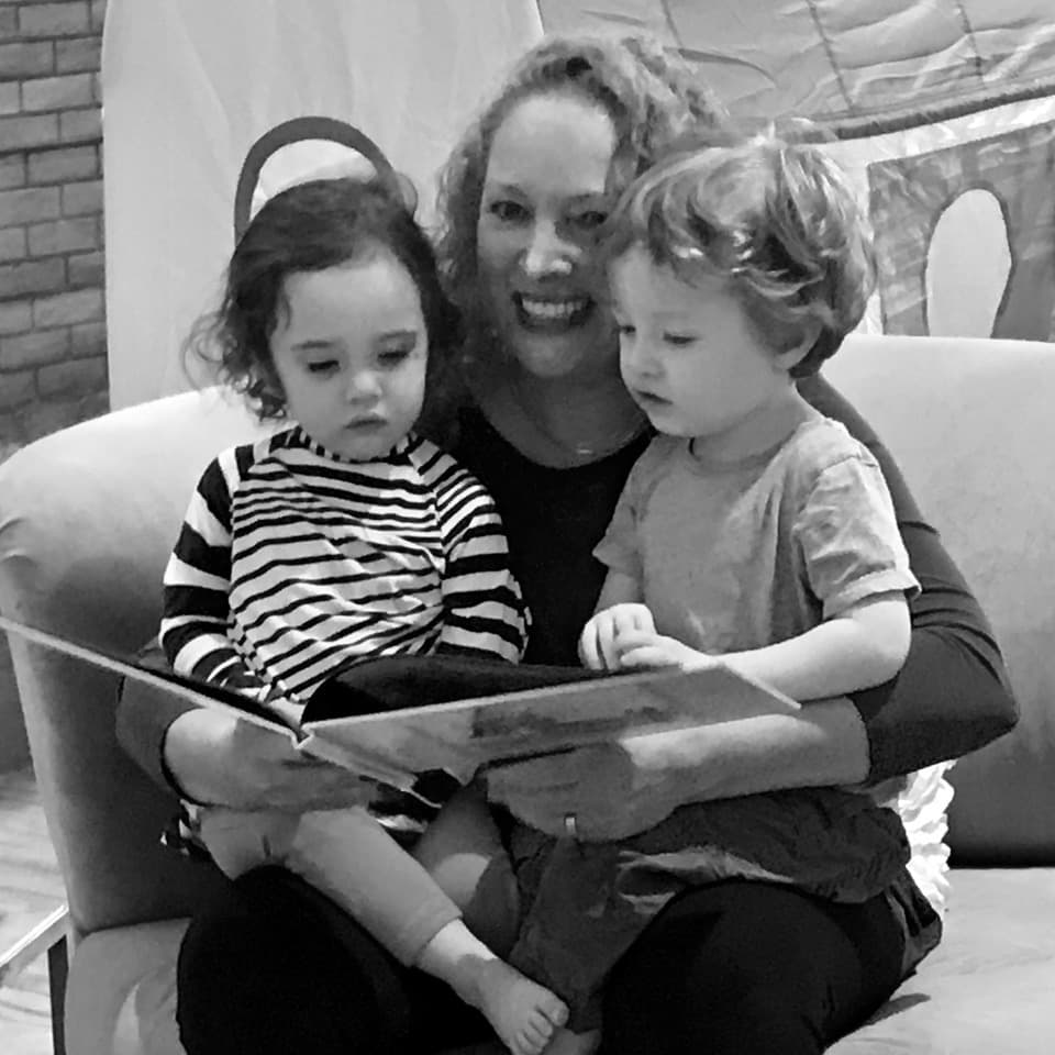Julia Frankel reading with her two children